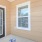 a patio with a table and a door with a window