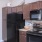 a kitchen with wooden cabinets