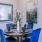 a dining table with blue chairs