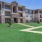a large building with a lawn in front of it