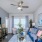 a living room with a blue couch and a television