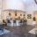 a large room with a bar and chairs