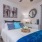 a bedroom with a bed and lamps